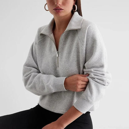 A cosy, gray fleece zip-up hoodie with a stylish turn-down collar, perfect for Kiwi autumn weather.