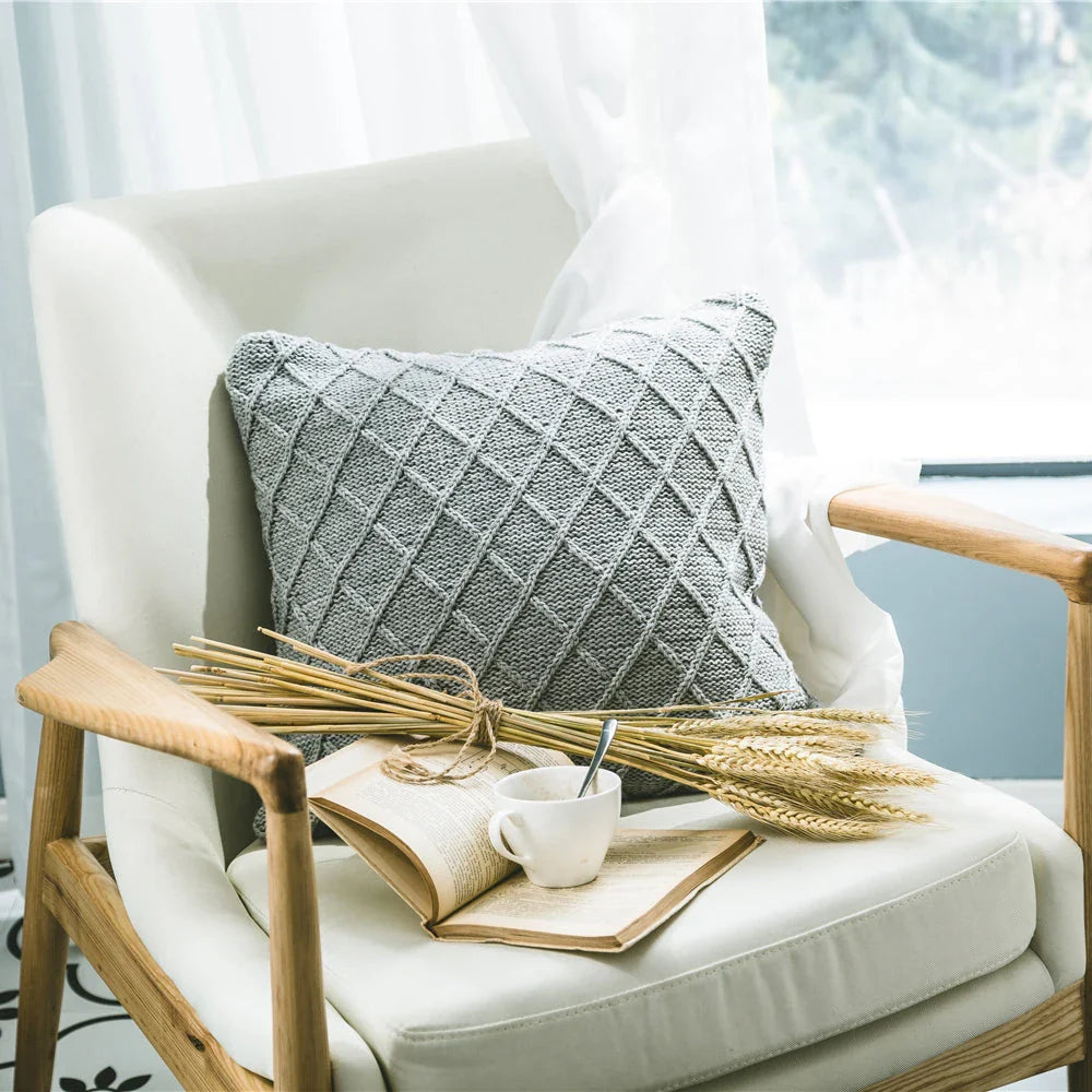 Elegant grey knitted decorative pillow case with intricate jacquard pattern and embroidered stripes