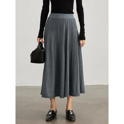 A stylish and versatile mid-calf pleated wool skirt in a chocolate color, perfect for the chilly seasons.