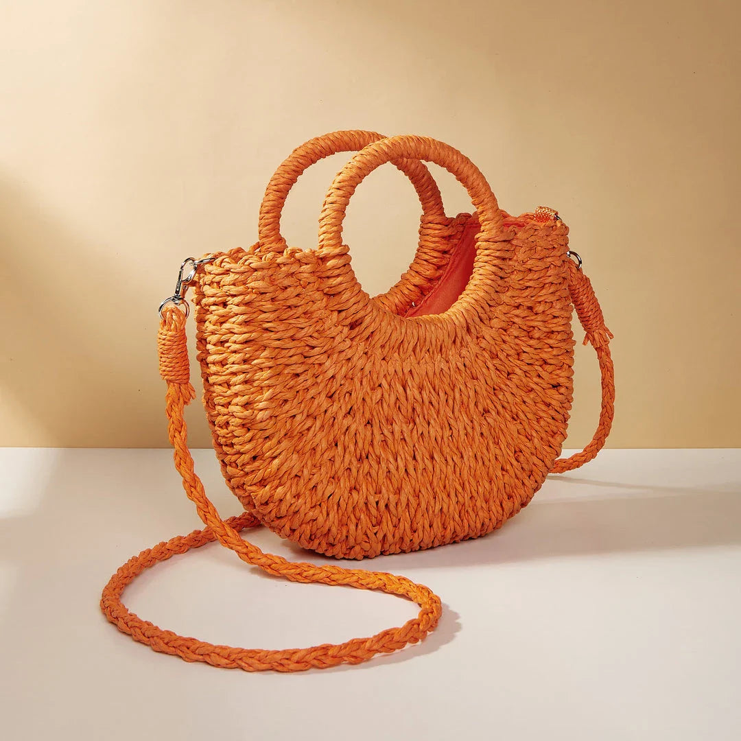 Stylish and eco-friendly straw woven beach bag for Kiwi women, featuring a unique half-moon shape, premium paper straw, and cotton lining.