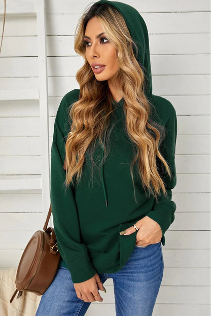 Comfortable drop-shoulder hoodie with stylish slit in green color, featuring a soft, stretchy fabric blend and practical drawstring closure