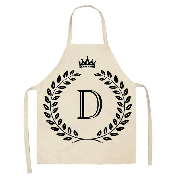 A crown and letter printed kitchen apron made of high-quality cotton and linen, suitable for both men and women in New Zealand kitchens.