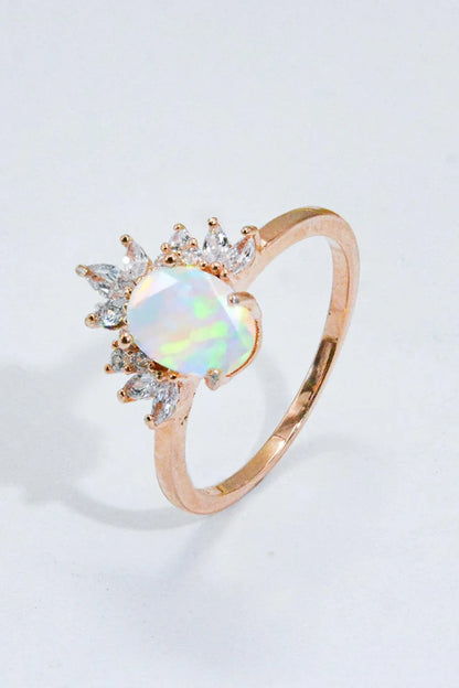 A close-up view of a 925 sterling silver ring featuring a shimmering opal stone, showcasing the modern and sustainable design.