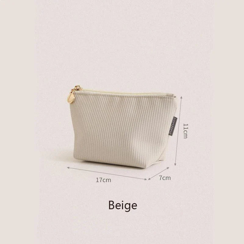 Compact and versatile mini cosmetic pouch in beige and gray colours, perfect for New Zealand travellers