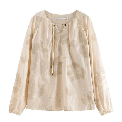 Sophisticated Kiwi-inspired beige floral print blouse with lace-up neck detail, ideal for office or casual wear