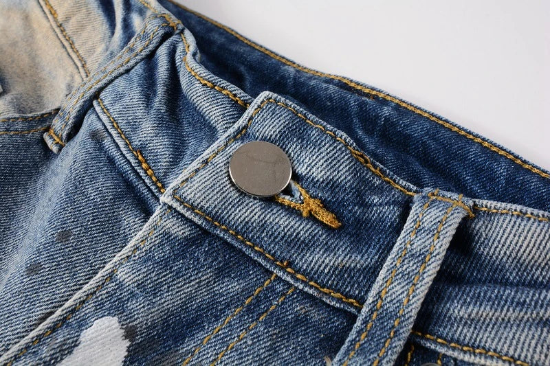 Vintage-inspired jeans with rhinestone and ink splash detailing, perfect for the modern Kiwi lifestyle