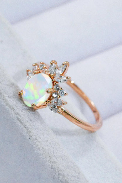 A close-up view of a 925 sterling silver ring featuring a shimmering opal stone, showcasing the modern and sustainable design.