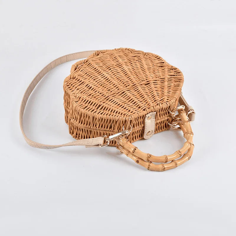 Rattan straw bag with intricate three-dimensional conch shell design, ideal for everyday use and a touch of coastal chic