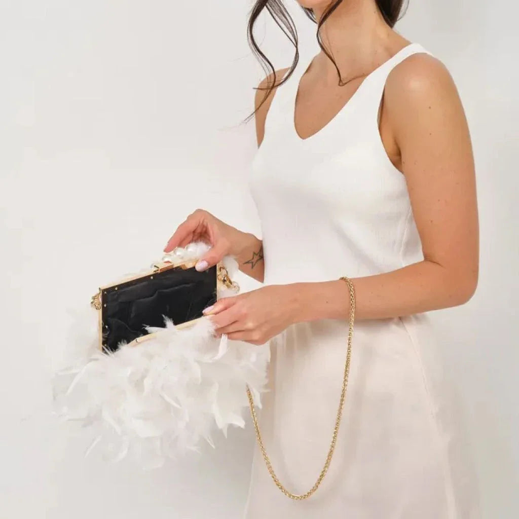 Elegant gray feather and pearl clutch with metal framework, a sophisticated accessory for Kiwi fashionistas