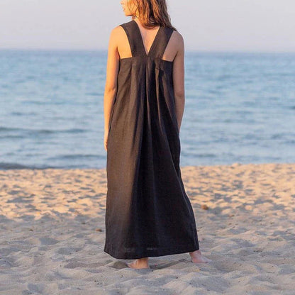 Stylish square collar sleeveless midi sundress in black, featuring a flowing A-line silhouette and practical pockets for versatile summer wear.