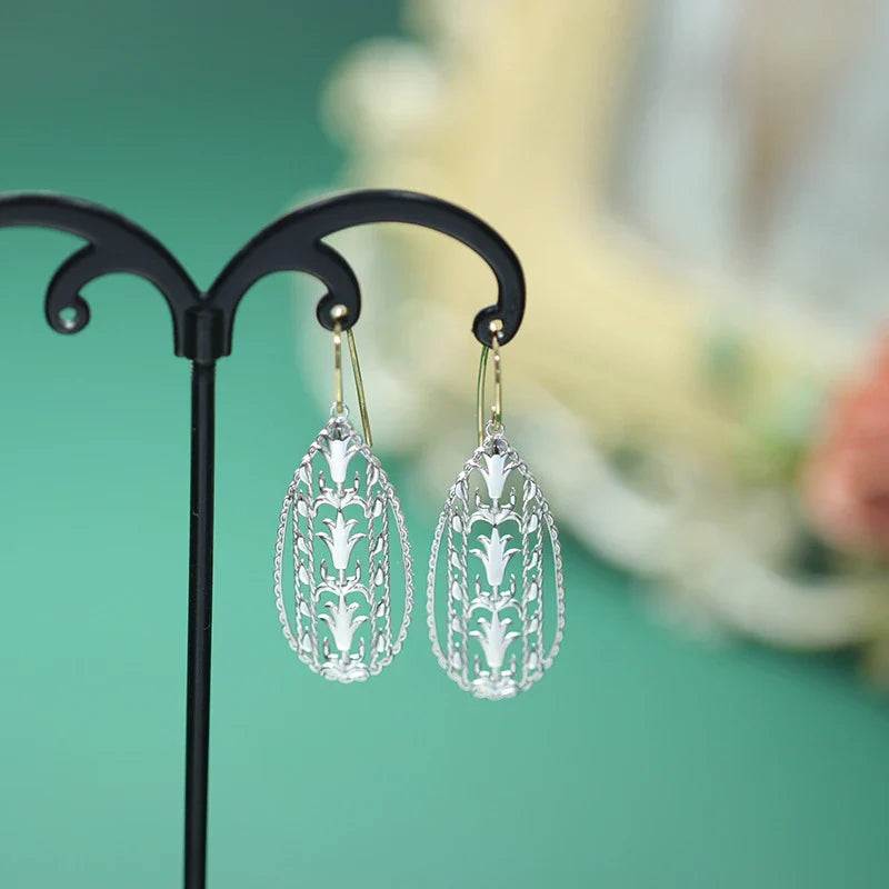 Elegant 925 sterling silver earrings with a captivating colour-changing effect, designed with a graceful water drop shape