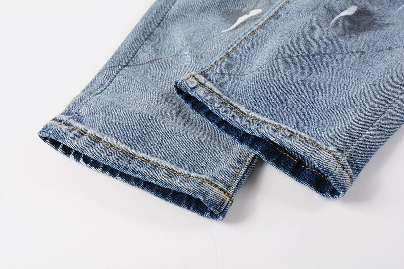 Vintage-inspired jeans with rhinestone and ink splash detailing, perfect for the modern Kiwi lifestyle