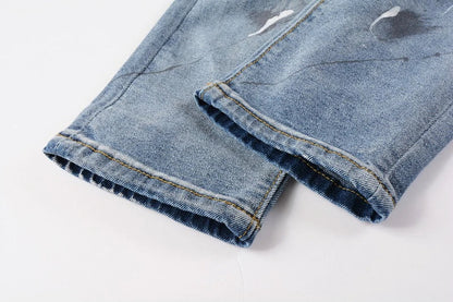 Vintage-inspired jeans with rhinestone and ink splash detailing, perfect for the modern Kiwi lifestyle