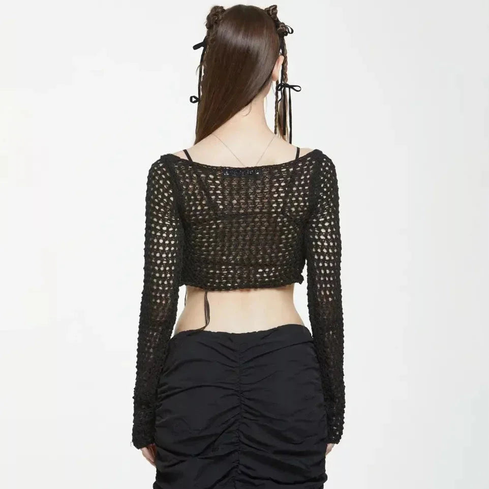 A stylish knitted sweater with hollow-out detailing and tassels, perfect for Kiwi autumn fashion