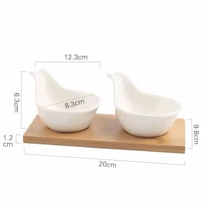 Stylish ceramic snack trays with natural wood pallet, perfect for serving nibbles and entertaining in Kiwi-style homes