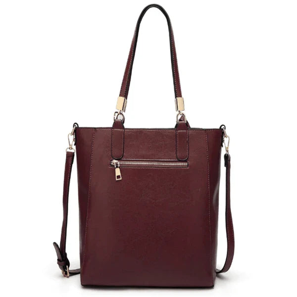 Stylish hollow handbag with adjustable straps, multiple interior pockets, and a durable PU leather construction