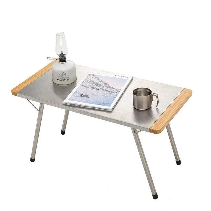 Portable bamboo folding table with stainless steel frame, ideal for outdoor activities like camping, picnics, and BBQs in New Zealand