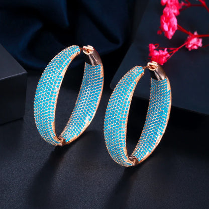 Elegant Blue Dream Ear Rings with a crown-inspired design and shimmering zircon stones