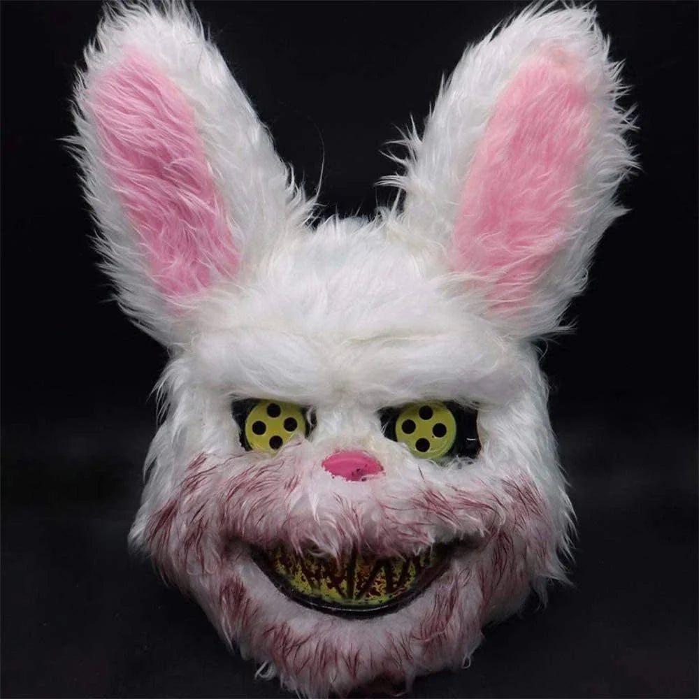 A creepy and realistic plush bunny mask with long pink ears, a bloody mouth, and glowing green eyes - perfect for Halloween and costume parties.