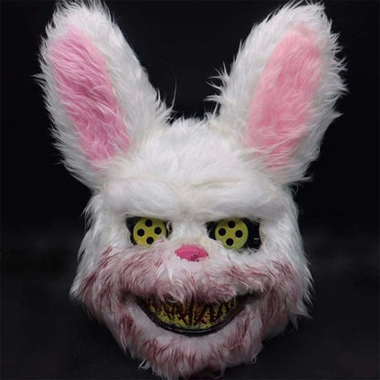 A creepy and realistic plush bunny mask with long pink ears, a bloody mouth, and glowing green eyes - perfect for Halloween and costume parties.