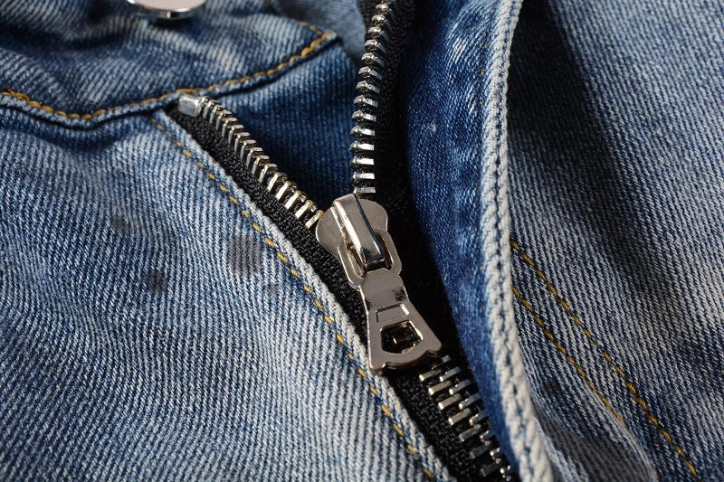 Vintage-inspired jeans with rhinestone and ink splash detailing, perfect for the modern Kiwi lifestyle