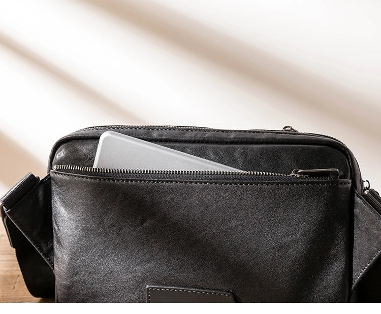 Stylish New Zealand-made leather shoulder bag in black for men, featuring a spacious design and adjustable strap for everyday use.