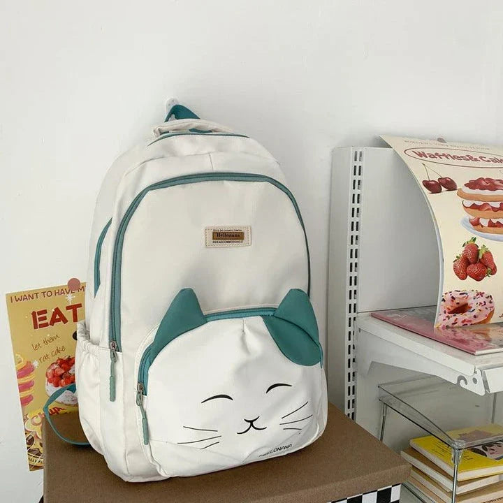 A stylish Japanese-inspired cat backpack with a large capacity, breathable nylon construction, and dedicated storage compartments for student essentials.