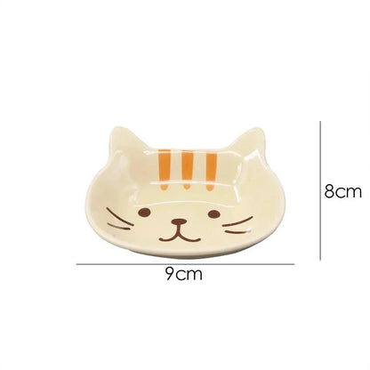 Charming Japanese-style ceramic condiment dish with a playful cat design, perfect for serving sauces, dips, and small snacks.