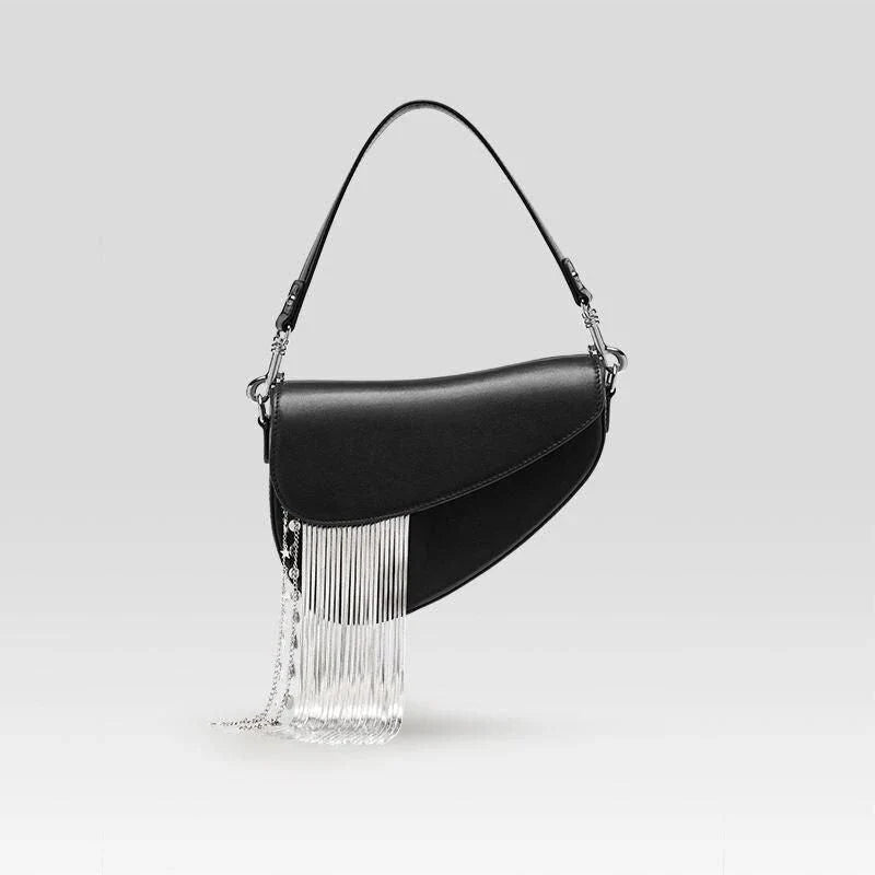 Stylish leather crossbody saddle bag with trendy tassel detail, perfect for everyday use or formal occasions