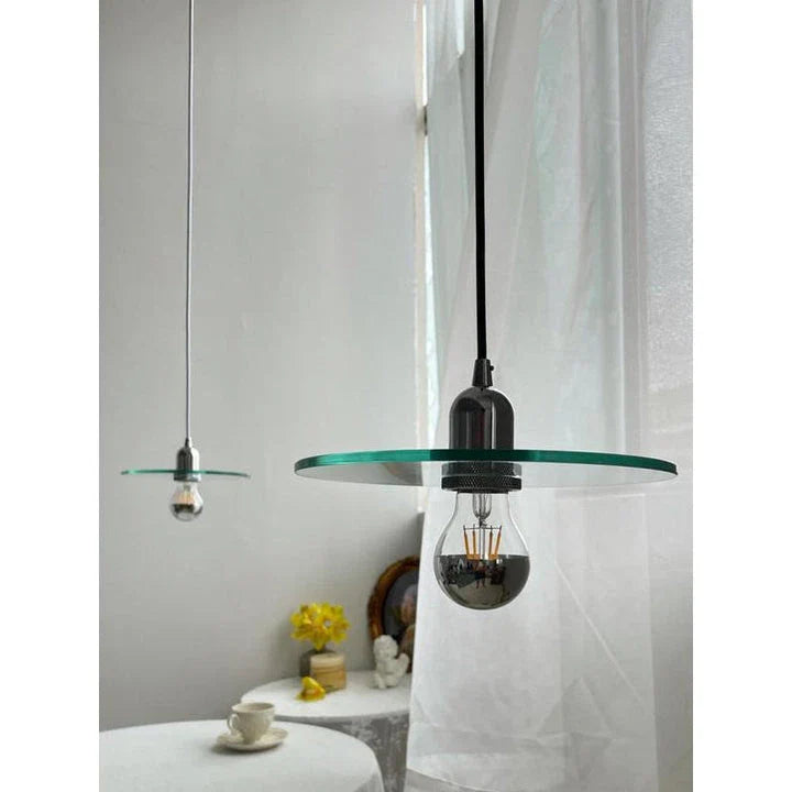 Elegant modern glass pendant light with a white shade, perfect for dining rooms, bedrooms, and other living spaces.