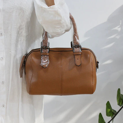 Classic leather shoulder bag in brown with a soft, pillowy shape and cotton lining for ultimate comfort and style