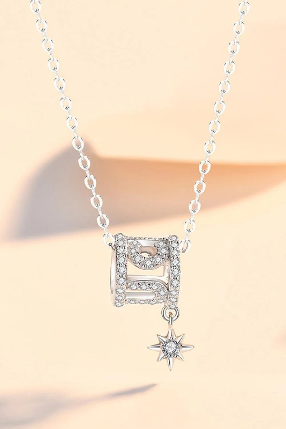 Sparkling cubic zirconia pendant necklace in silver, featuring a minimalist star-inspired design and premium 925 sterling silver construction