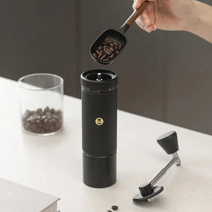 Premium manual coffee grinder with sleek design, stainless steel burrs, and external grind adjustment for customizable brewing