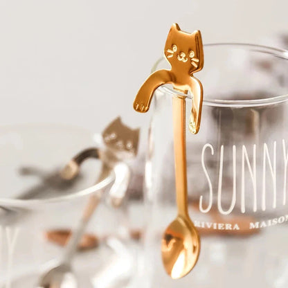 Charming cat-shaped stainless steel teaspoon with a sleek gold finish, perfect for Kiwi kitchens