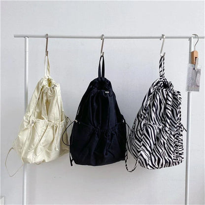 A stylish drawstring bucket bag made of premium polyester fabric, available in a variety of on-trend colours to complement your New Zealand fashion