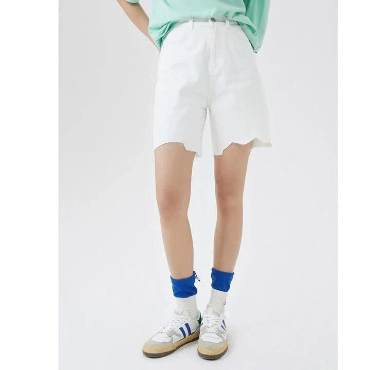 100% cotton A-line Bermuda denim shorts with unique wave cut decoration, available in a versatile solid white color