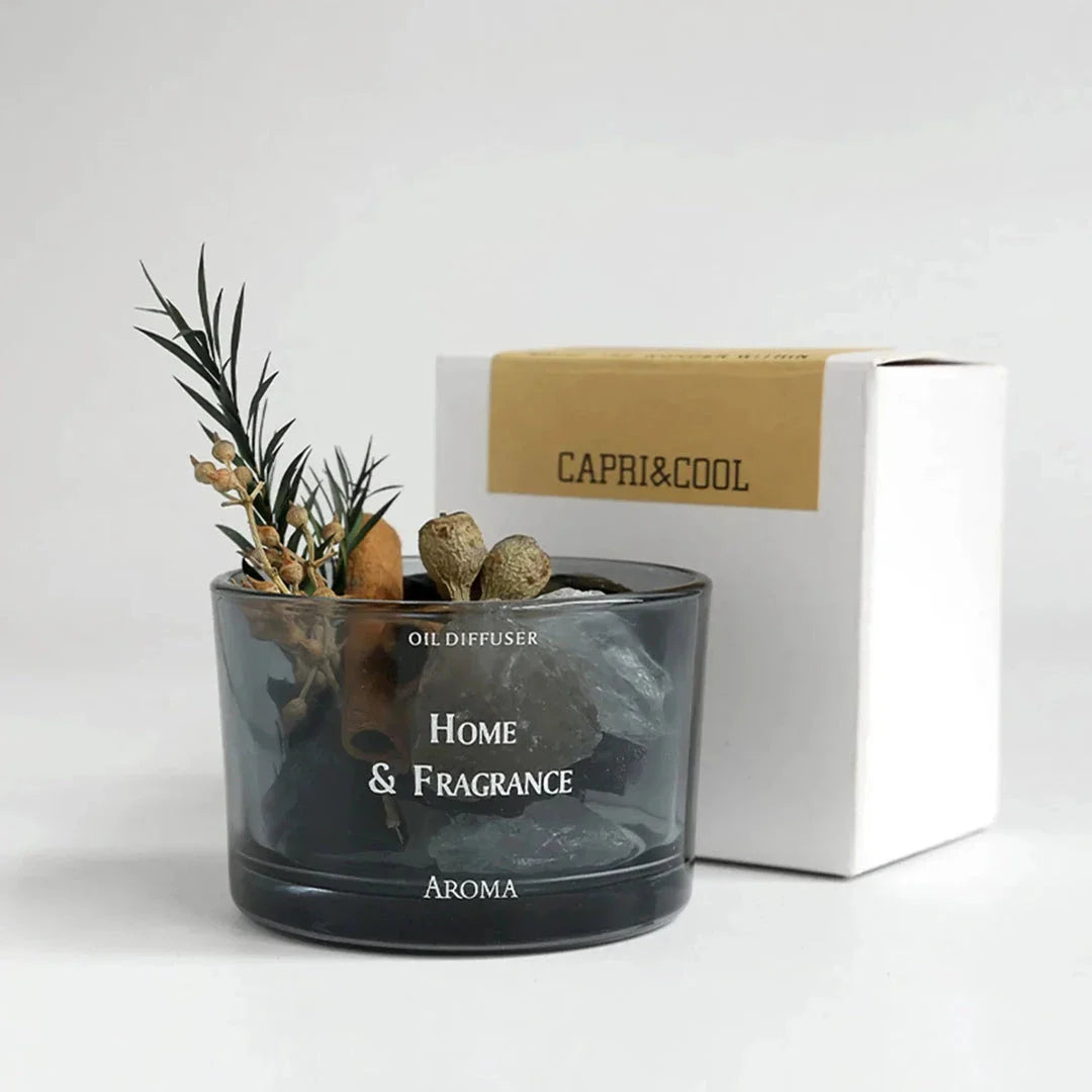 Natural Stone Essential Oil Diffuser with decorative flowers and plants, creating a serene and tranquil atmosphere