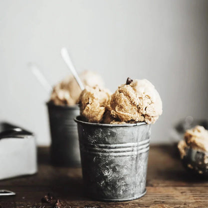 Vintage-inspired metal beverage cup with a charming wrought iron handle, perfect for serving desserts, fruits, and snacks