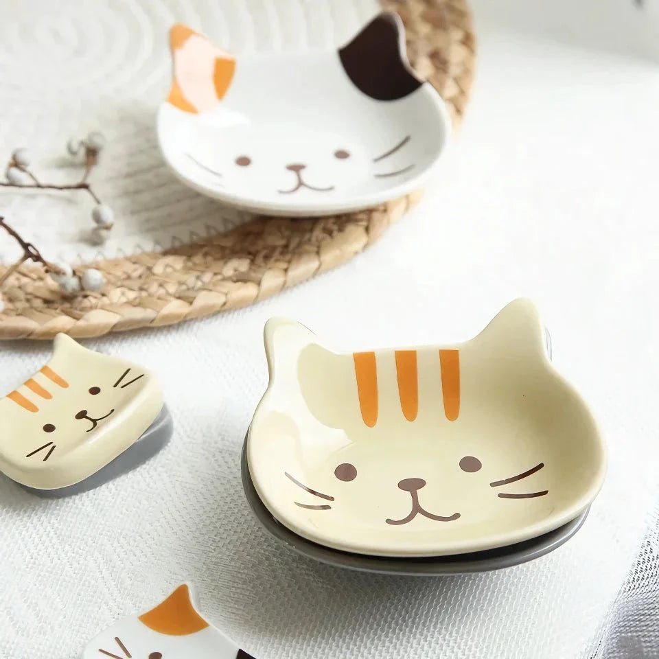 Charming Japanese-style ceramic condiment dish with a playful cat design, perfect for serving sauces, dips, and small snacks.