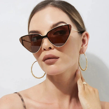 Stylish metal cat-eye sunglasses with premium alloy frames and polycarbonate lenses, offering UV400 protection and a trendy, fashionable look for the discerning Kiwi consumer.