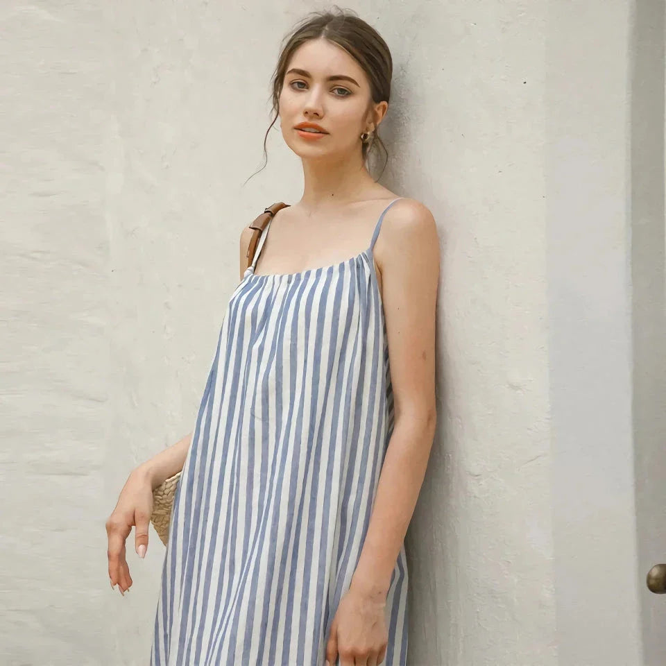 A stylish striped cotton linen maxi dress with an elegant A-line silhouette, perfect for summer in New Zealand.