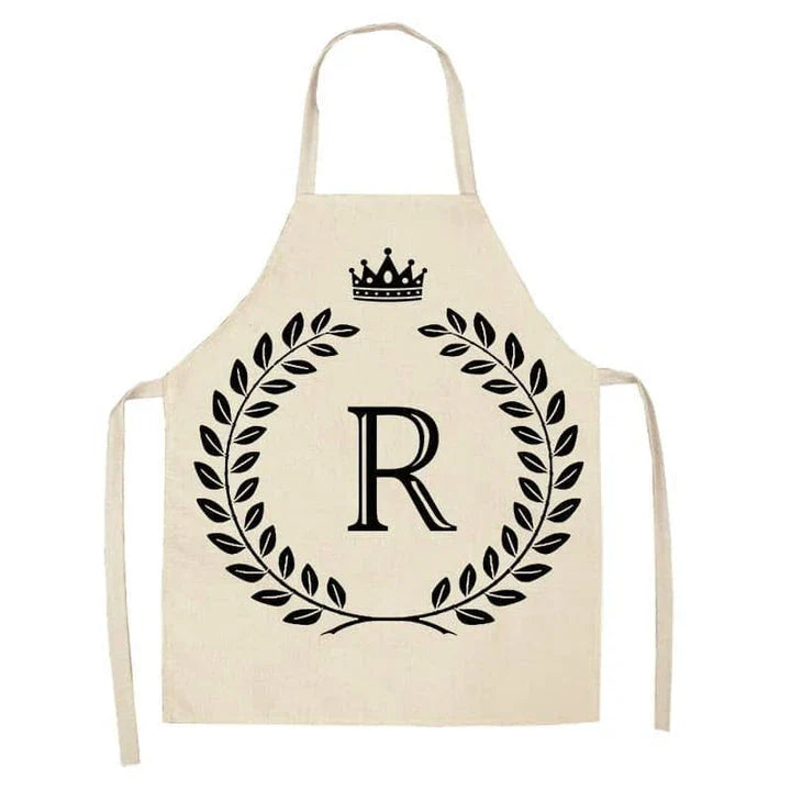 A crown and letter printed kitchen apron made of high-quality cotton and linen, suitable for both men and women in New Zealand kitchens.
