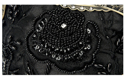 Bead embroidered fashion bag with silk surface, nylon exterior, and magnetic buckle closure