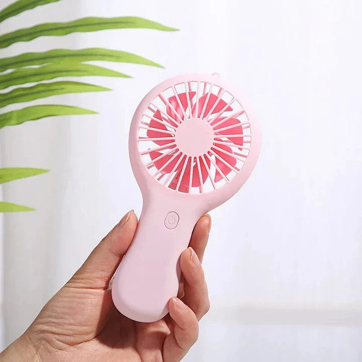 Compact USB-powered mini fan with adjustable speeds and quiet operation, ideal for home, office, and travel use