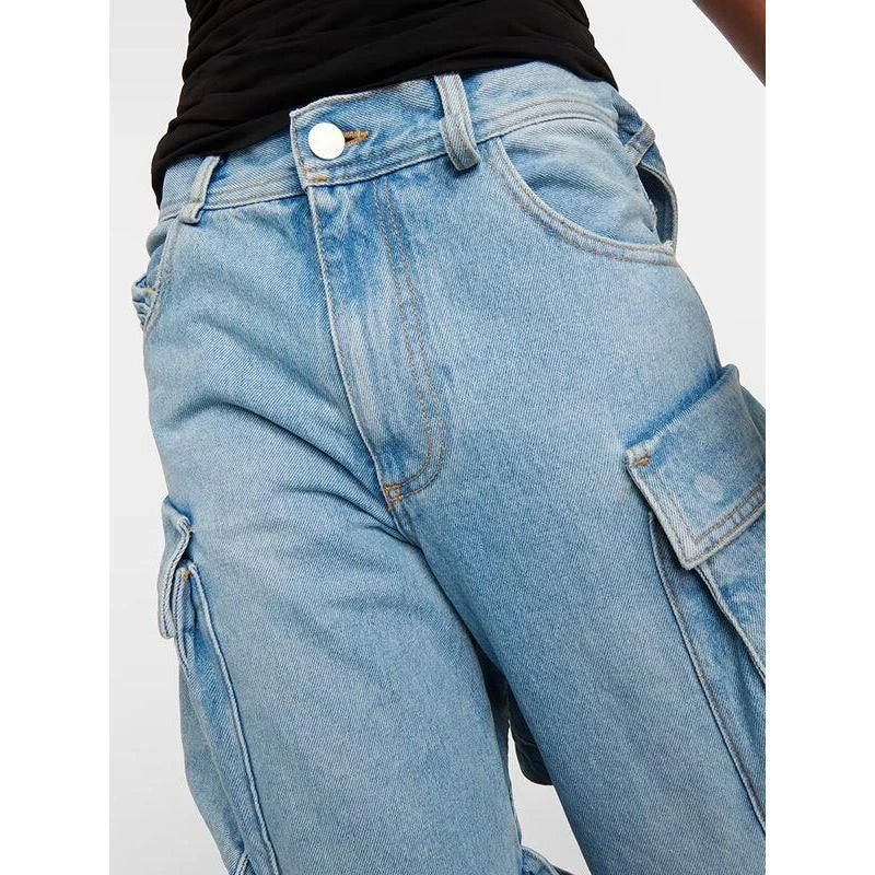 A pair of high-waisted, spliced cargo denim trousers with a distinctive patchwork and hollow-out design