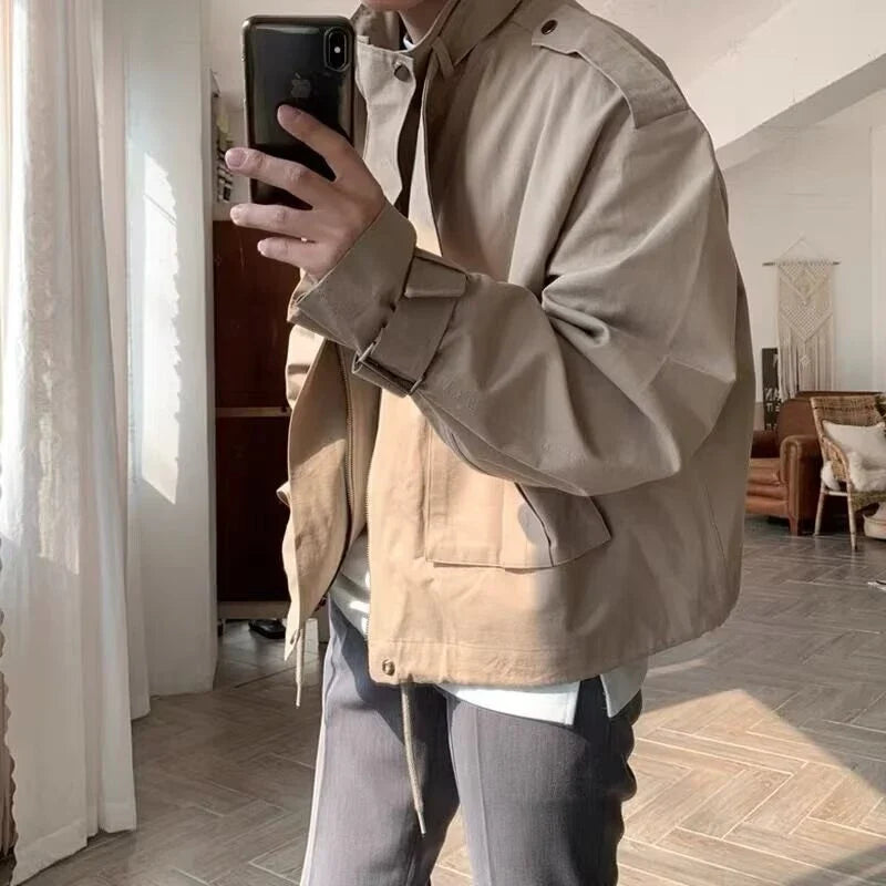 A stylish vintage-inspired jacket with an overalls-inspired design, featuring a lightly mature aesthetic and premium construction.