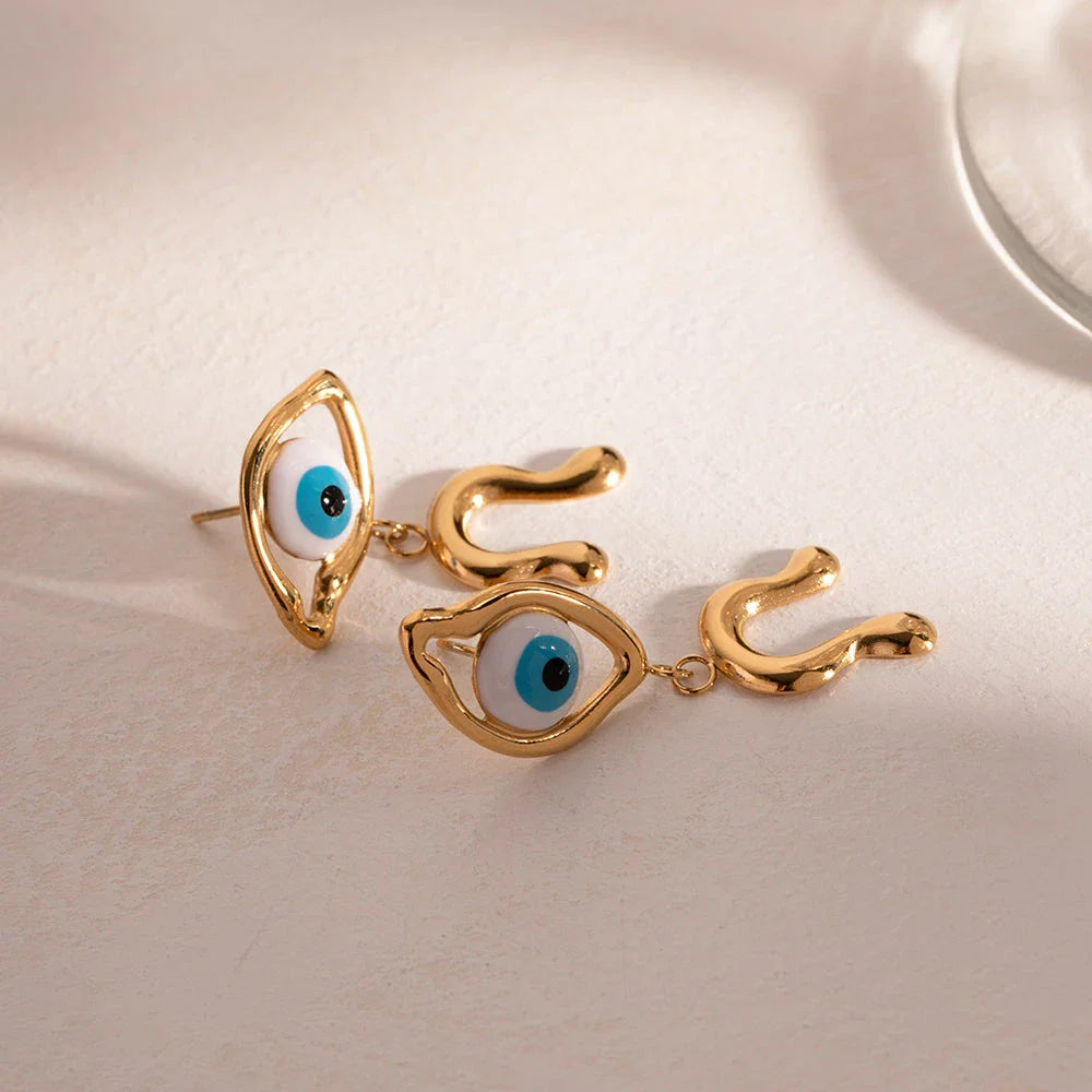 Pair of 18K gold plated stainless steel asymmetrical devil's eye earrings with vibrant, dripping oil-inspired finish