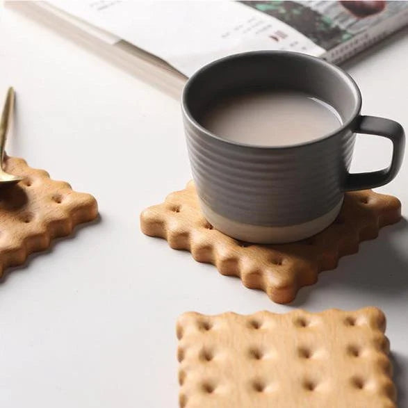 Natural wooden cookie-shaped coasters in beige and brown, handcrafted in New Zealand from premium solid wood