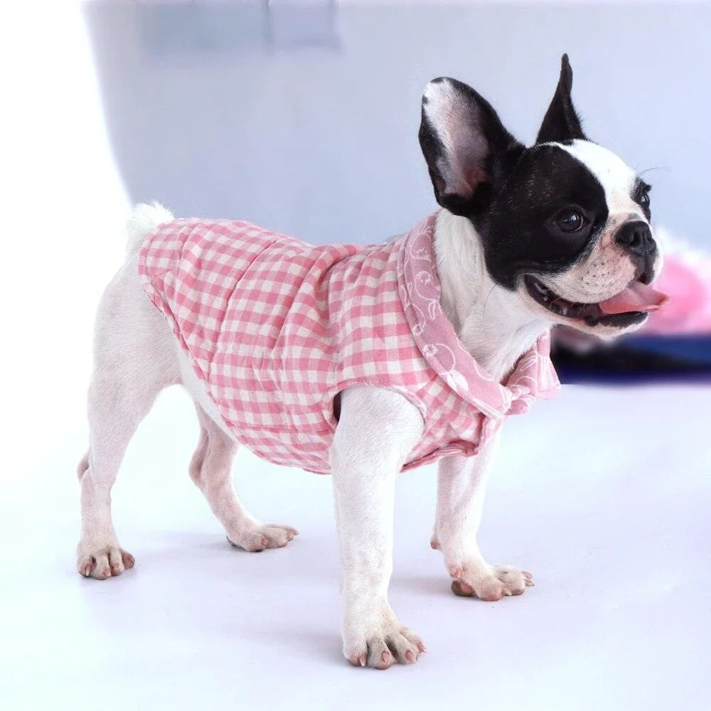 Stylish plaid pet vest for dogs in a variety of sizes, featuring a sleeveless design and durable polyester material.
