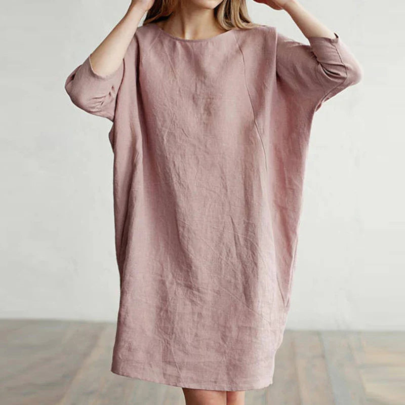 A cotton and linen dress with a round neckline, pockets, and an A-line silhouette in various colors.